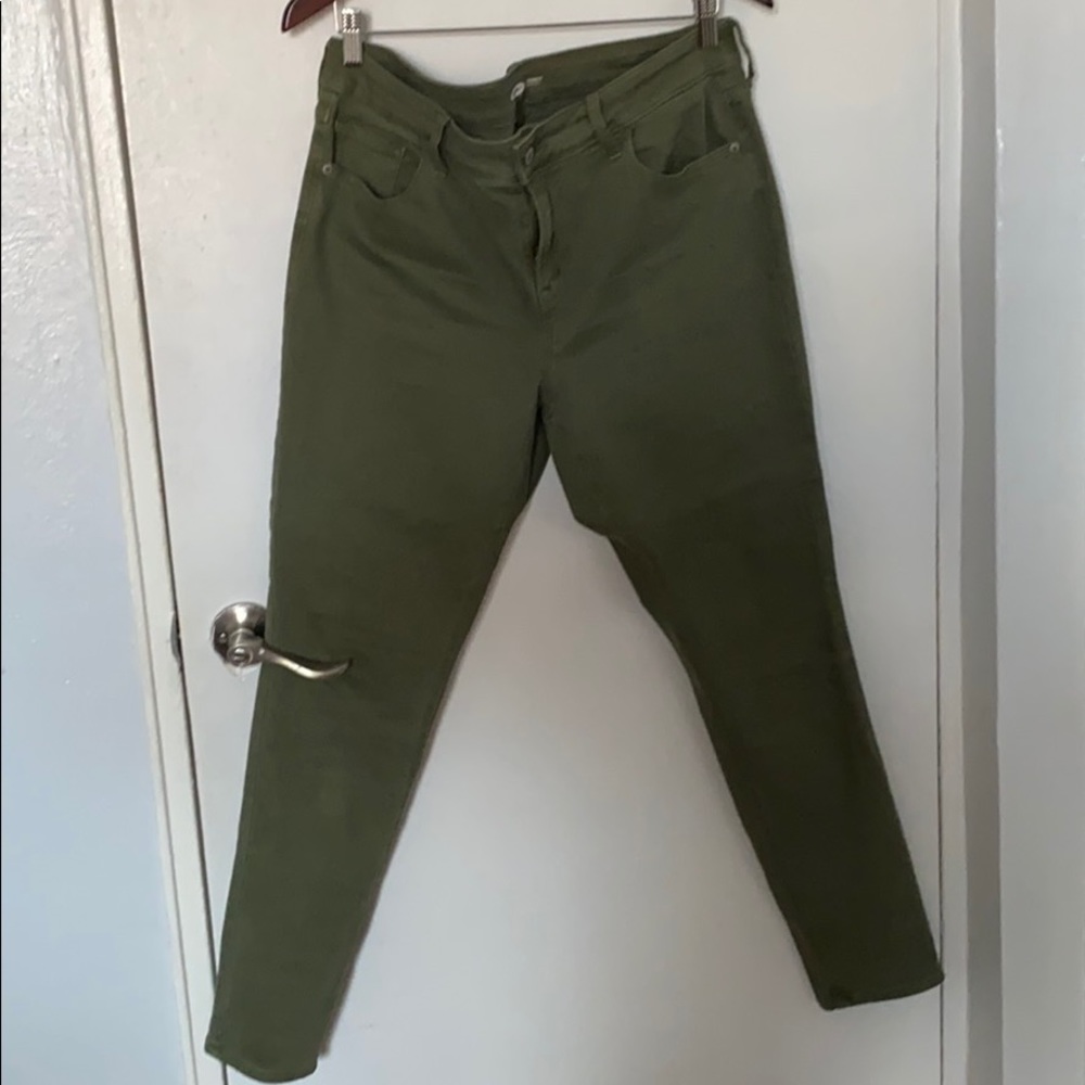 Green skinny legged jeans